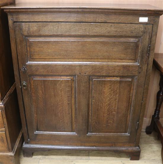 A late 18th / 19th century oak cupboard, W.97cm